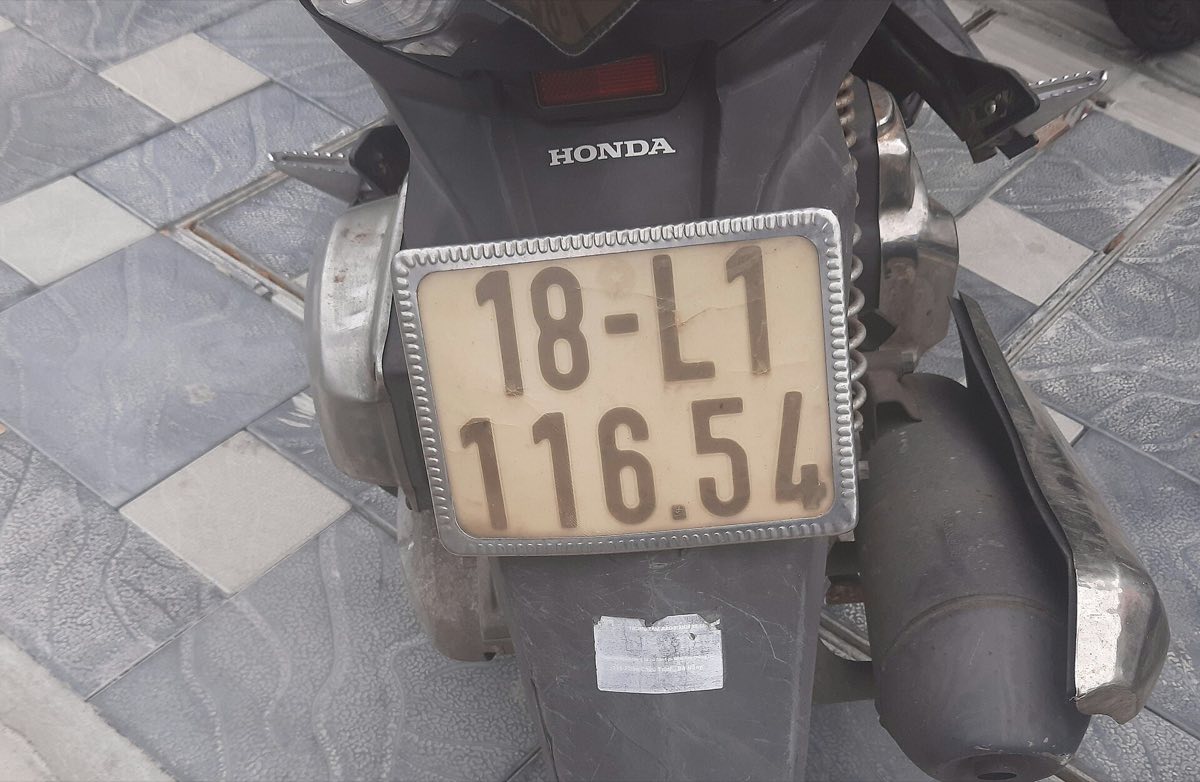 The registration plate on a Honda scooter in Vietnam